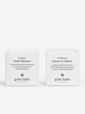 Grön Lycka schampokaka Sunlit Shimmer och balsamkaka Queens of Volume i förpackningar